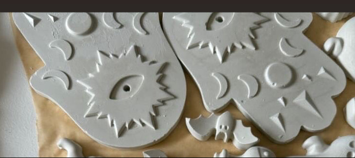 A collage showing a set of unpainted beige ceramic Hamsa hand molds and a large round base plate, with text overlays explaining that the Hamsas are an incense holder.