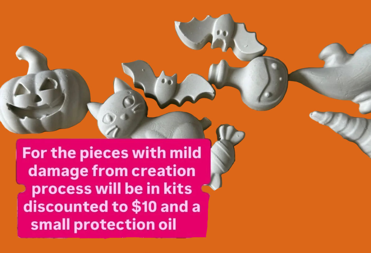 A collection of unpainted gray Halloween decor arranged on tan paper, with overlaid pink text boxes containing promotional copy about kits and mild damage.